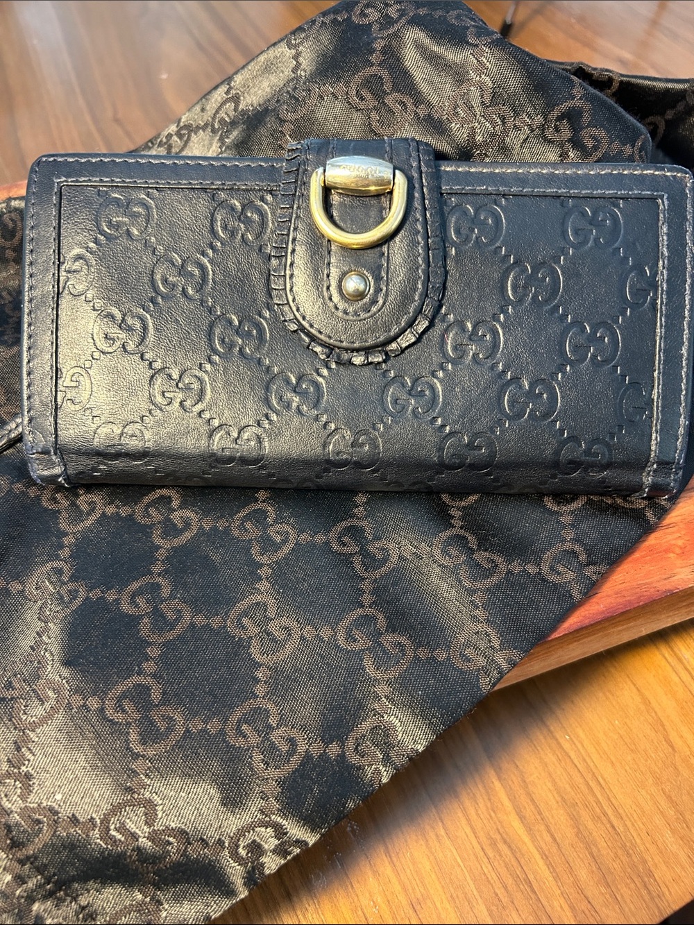 Gucci Navy Embossed GG Leather Wallet with Gold-Tone Accent